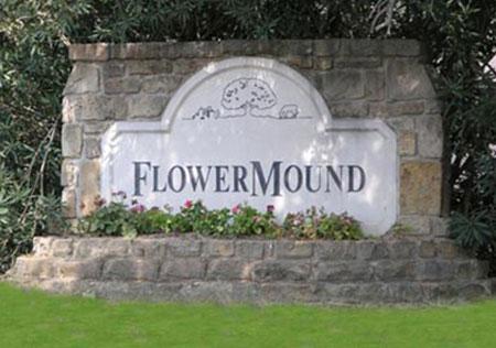 brick landmark that reads Flower Mound