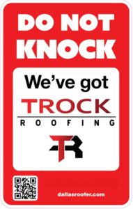 Red and white sign reads,