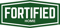 A green hexagonal logo with a white border features the bold white text "FORTIFIED" above smaller white text "HOME" in the center. - T Rock Roofing and Contracting A green hexagonal logo with a white border features the bold white text "FORTIFIED" above smaller white text "HOME" in the center.